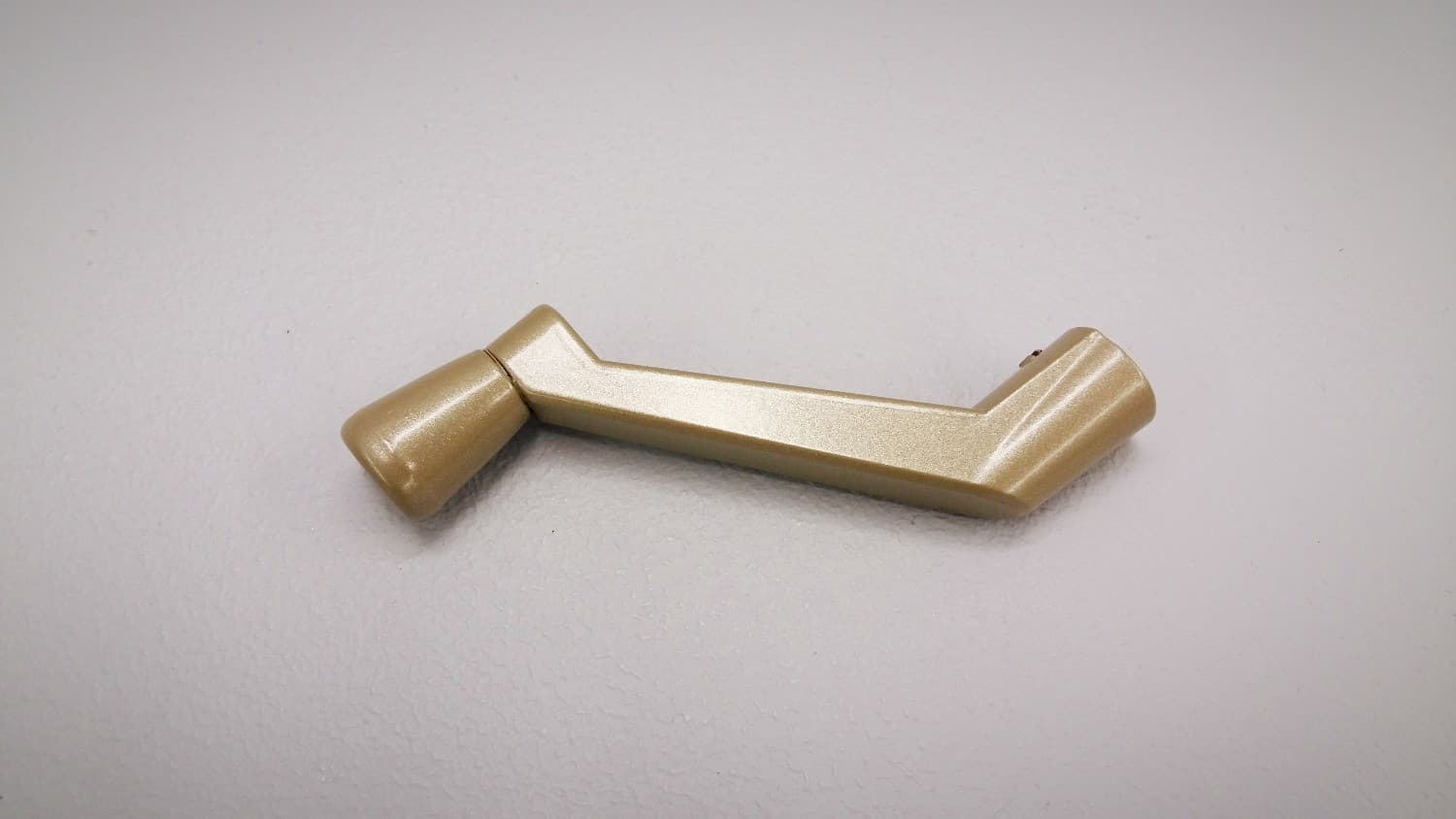 Poignée fixe champagne pour opérateur de fenêtre à battant - Image 1