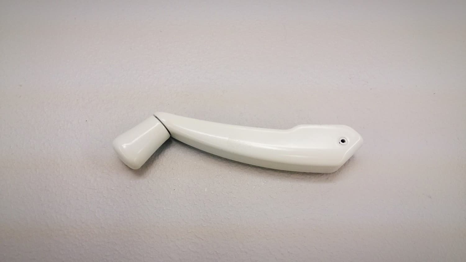 Poignée pliante pour opérateur de fenêtre à battant blanc - Image 1